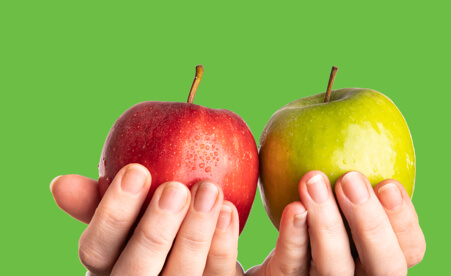Image containing hands holding red and green apples